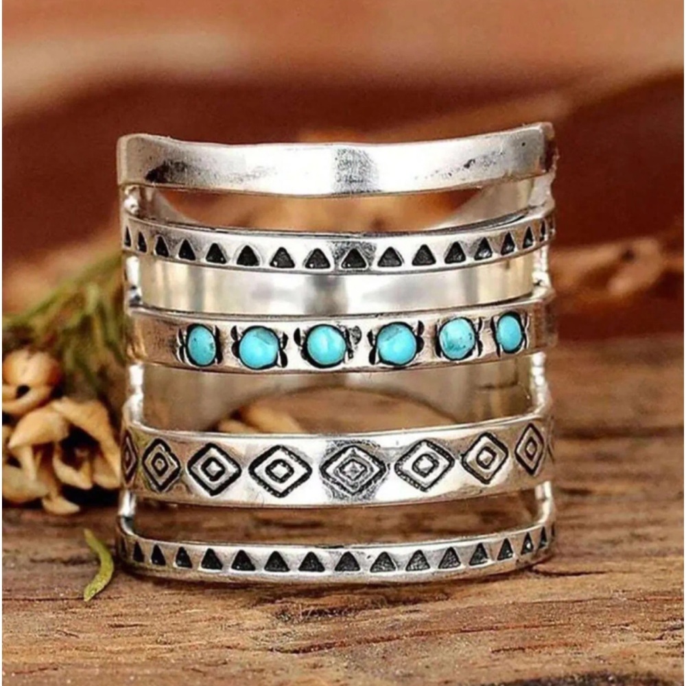 One piece Boho style ring with turquoise accents. Size: 7